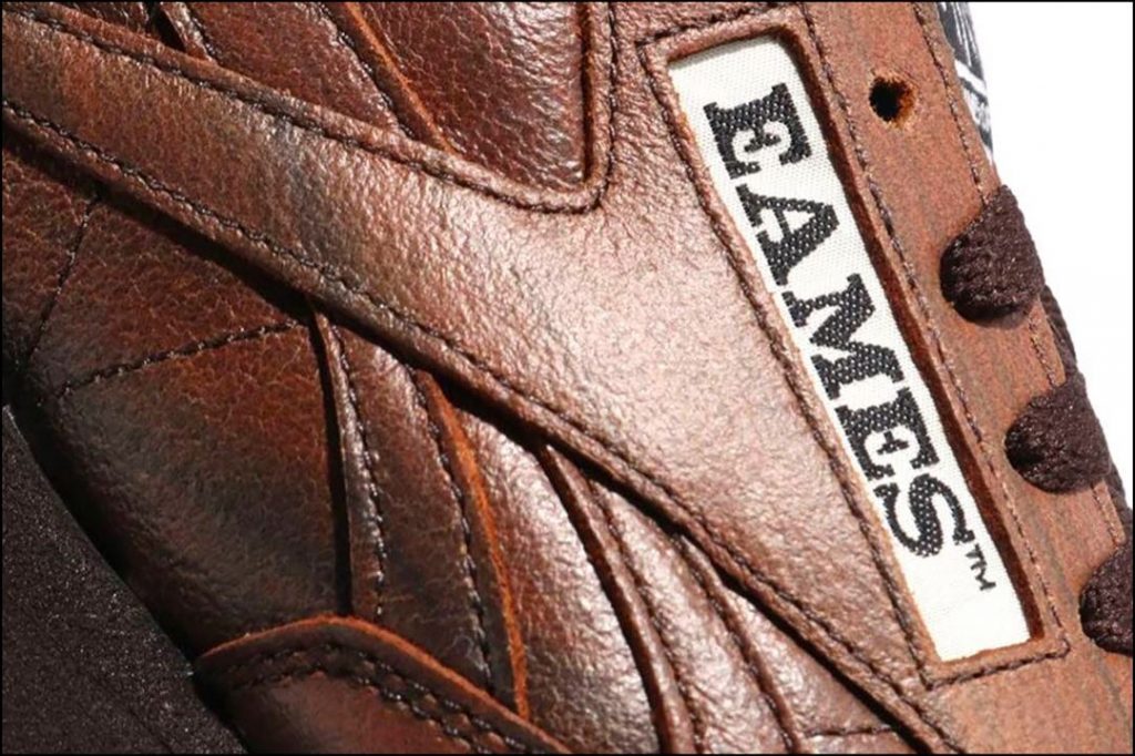 Primer plano de un objeto de diseño y deseo: la zapatilla deportiva Eames Office x Reebok Classic Leather. 