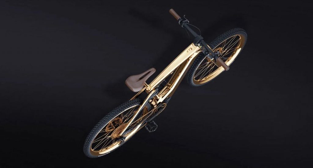 La bicicleta Porsche Cross eBike dorada fue fabricada en colaboración con la empresa alemana de bicicletas de montaña Rotwild.
